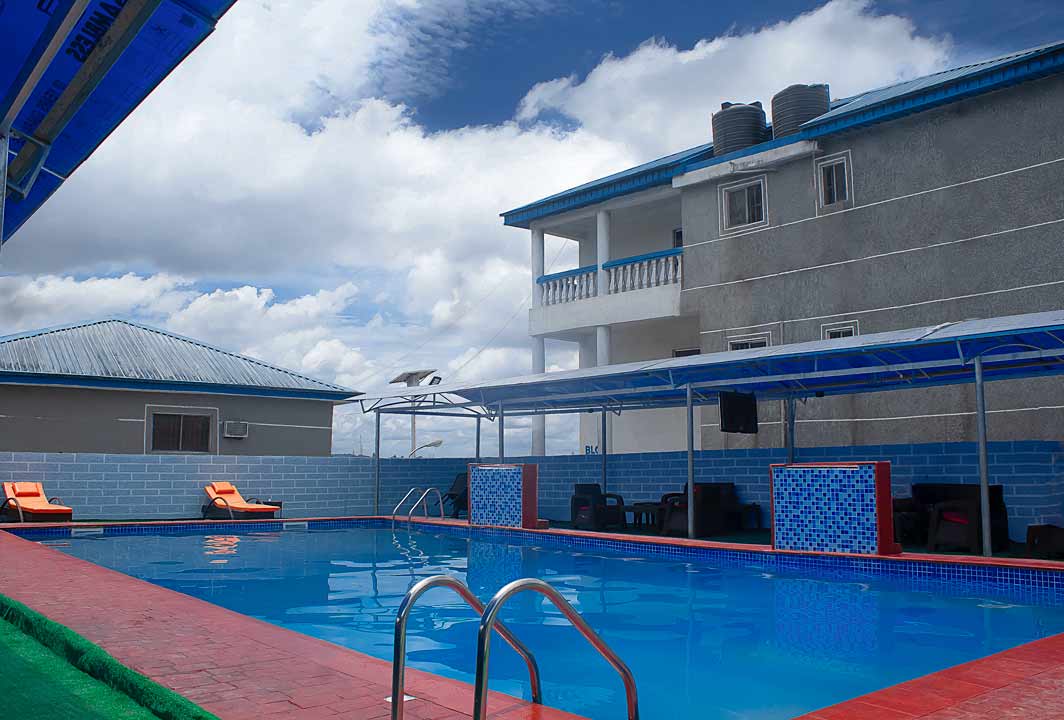 Poolside area at Akiavic Blue Roof Hotel